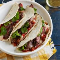 Salsa-Marinated Skirt Steak Soft Tacos with Refried White Beans image