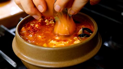 spicy-soft-tofu-stew-with-seafood-cooking-korean-food image