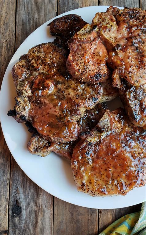juicy-grilled-pork-chops-with-spicy-peach-glaze-video image