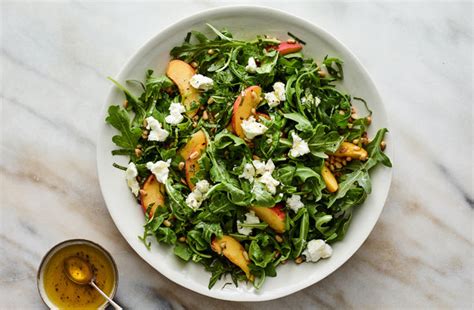 arugula-salad-with-peaches-goat-cheese-and-basil image