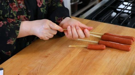 hot-dog-french-fries-on-a-stick-cooking image