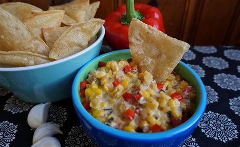 hot-corn-dip-with-crispy-tortilla-chips-a-wolff-family image