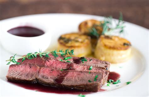 steak-with-bordelaise-wine-sauce-and-fondant-potatoes image