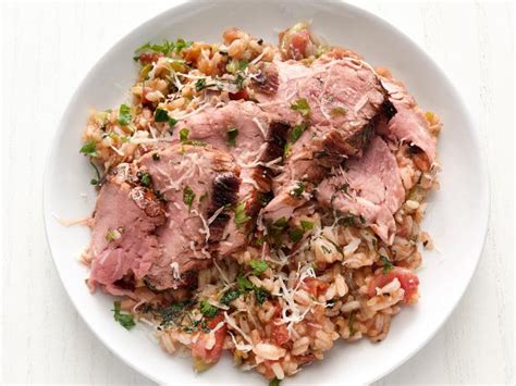 herb-crusted-pork-tenderloin-with-tomato-rice-food image