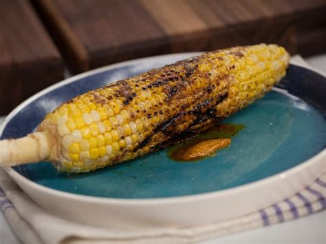grilled-corn-with-ancho-chile-butter-food-network image