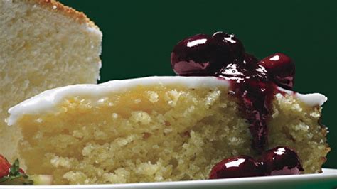 lemon-cornmeal-cake-with-lemon-glaze-and-crushed-blueberry image