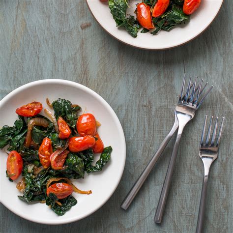 stir-fried-kale-with-tomatoes-food-wine image
