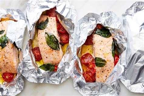 salmon-and-tomatoes-in-foil-recipe-nyt-cooking image