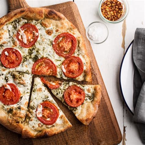 pizza-with-pesto-fresh-tomatoes-and-mozzarella image
