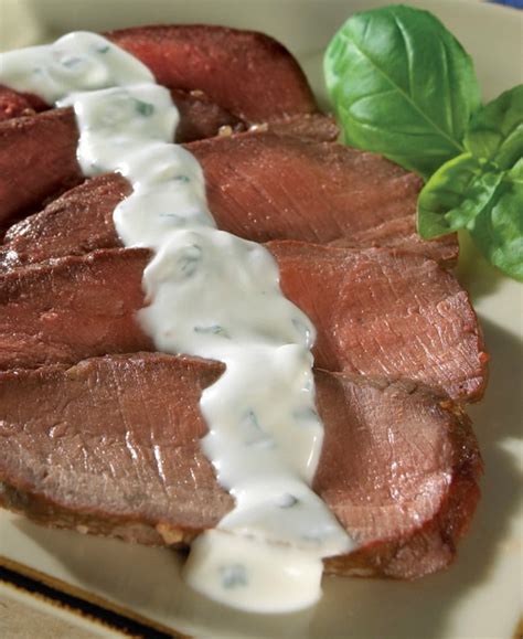 grilled-steak-with-creamy-herbed-goat-cheese-sauce image