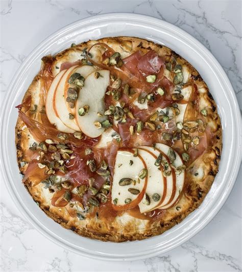 goat-cheese-prosciutto-pistachio-pizza image