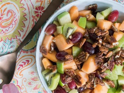 spiced-honey-fruit-salad-with-pecans-food-network image
