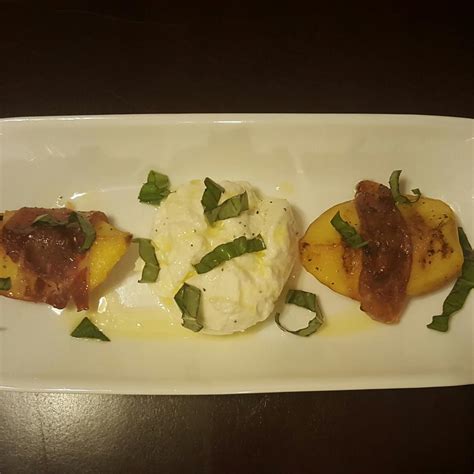 grilled-prosciutto-wrapped-peaches-with-burrata-and-basil image