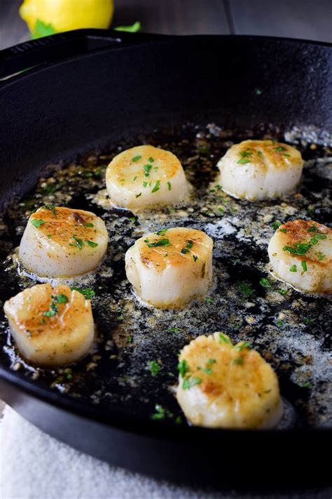 pan-seared-scallops-with-lemon-butter-recipe-kitchen-swagger image