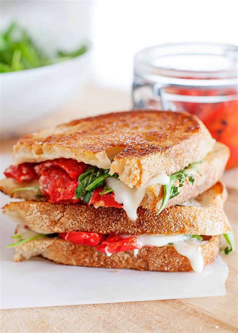 grilled-cheese-sandwich-with-red-peppers-arugula image