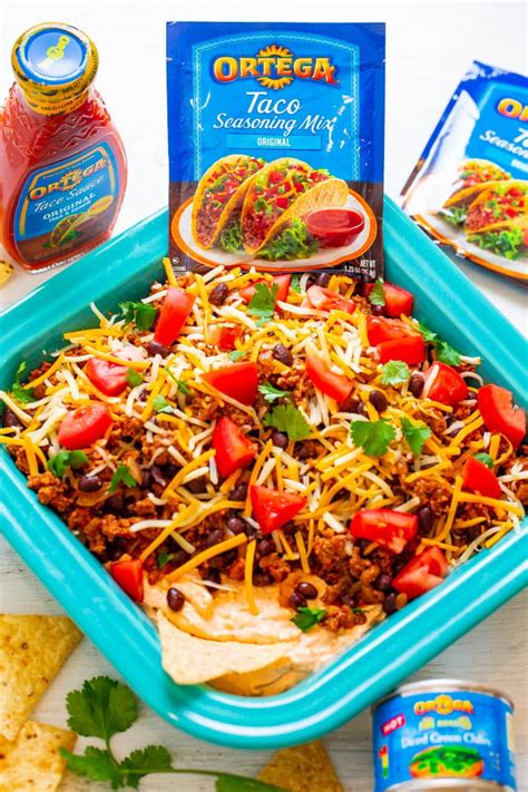 layered-taco-dip-with-ground-beef-averie-cooks image