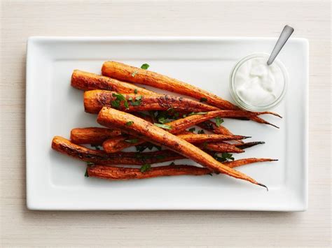 cumin-roasted-carrots-with-greek-yogurt-recipe-food image