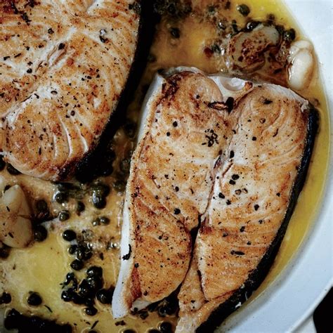 butter-basted-halibut-steaks-with-capers-recipe-epicurious image