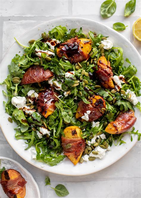 grilled-prosciutto-wrapped-peaches-with-arugula image