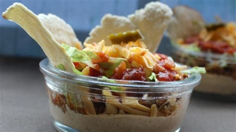 layered-taco-dip-with-meat-recipe-allrecipes image