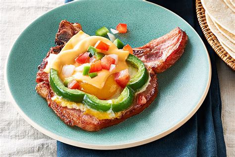 cheesy-egg-topped-smoked-pork-chops-my-food-and-family image