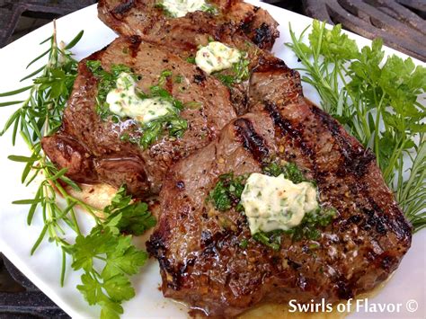 petite-sirloin-steak-with-fresh-herb-butter-swirls-of image