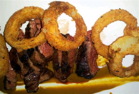rib-eye-steaks-with-corn-meal-fried-onion-rings image