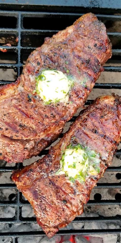 grilled-rib-eye-steaks-with-roasted-garlic-herb-butter image