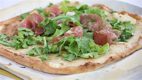 goat-cheese-and-honey-pizza-with-prosciutto-and-arugula image