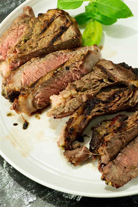 herb-marinated-steak-tender-grilled-steak-butter image