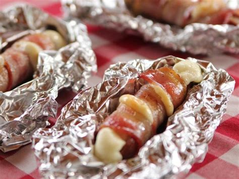 cheesy-bacon-hot-dogs-recipe-ree-drummond image