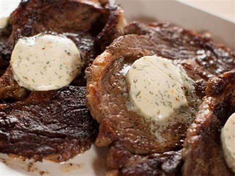 rib-eye-steaks-with-cowboy-butter-recipe-food-network image