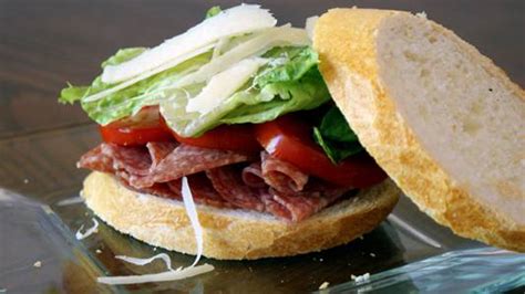 salami-sandwich-with-tomatoes-and-parmesan-uncle image