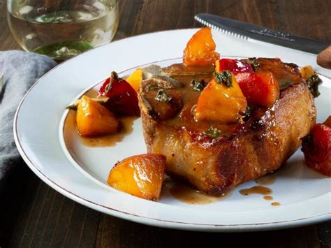 pork-chops-with-glazed-peaches-recipe-food-network image