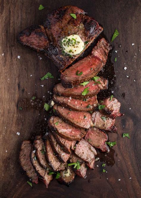 grilled-sirloin-steak-topped-with-herb-compound-butter image