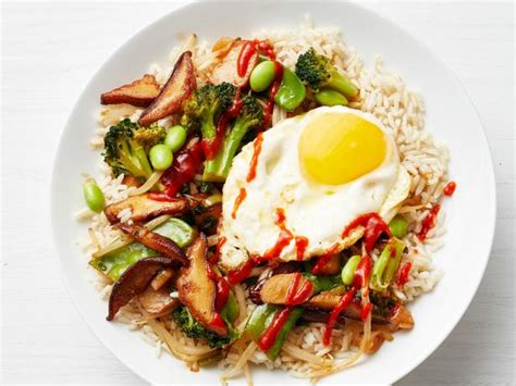 rice-bowls-with-fried-eggs-recipe-food-network image