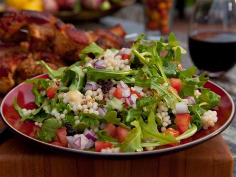 israeli-couscous-and-arugula-salad-recipe-food image