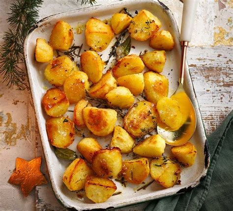 herby-roast-potatoes-recipe-bbc-good-food image