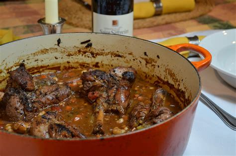 braised-lamb-shanks-with-tomatoes-and-white-beans image