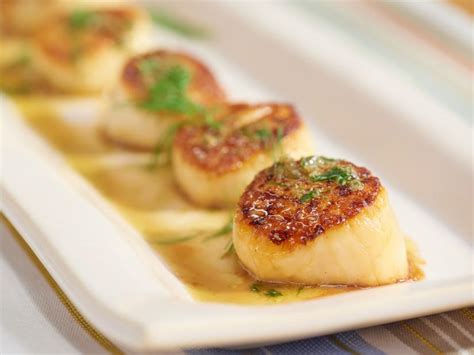 seared-diver-scallops-with-caper-honey-sauce-food image