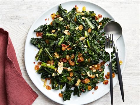 kale-with-golden-raisins-and-pine-nuts image
