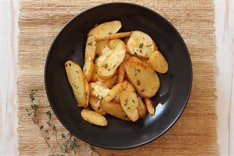 oven-roasted-parsnips-with-fresh-thyme-and-sea-salt image
