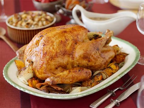 brined-herb-roasted-turkey-recipe-food-network image