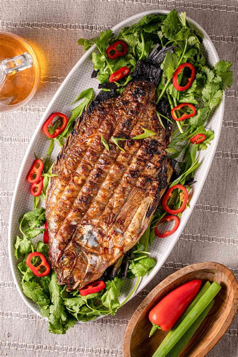 grilled-whole-fish-stuffed-with-herbs-and-chilies image