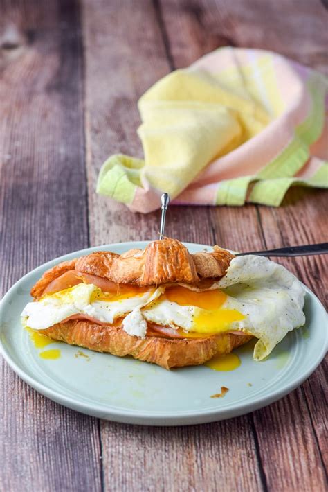 croissant-sandwich-with-ham-eggs-cheese-dishes image