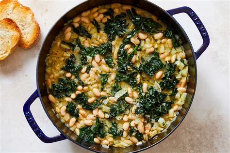 braised-white-beans-and-greens-with-parmesan-nyt image