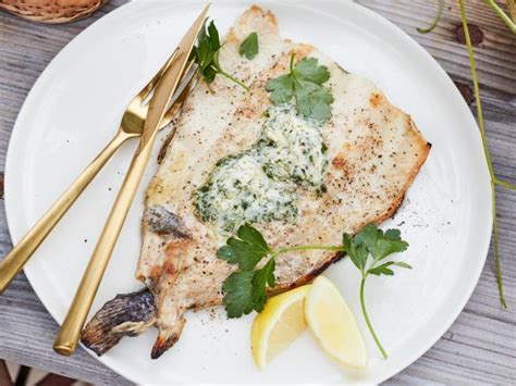 grilled-butterflied-trout-with-lemon-parsley-butter-food-network image