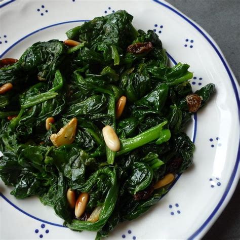 sauteed-spinach-with-pine-nuts-and-raisins image
