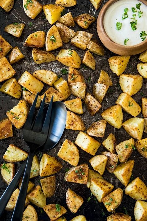 best-oven-roasted-garlic-potatoes-must-love-home image