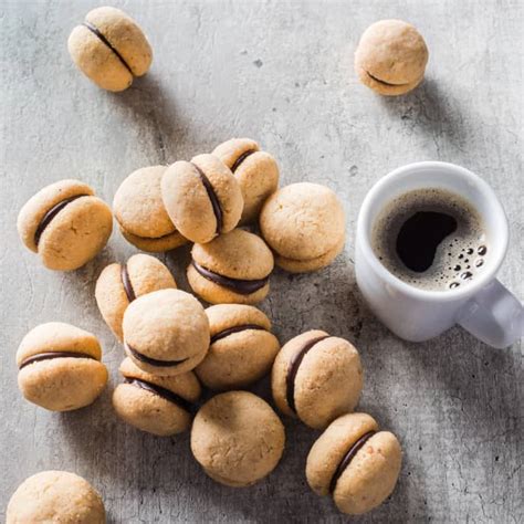 baci-di-dama-italian-hazelnut-cookies-americas-test image